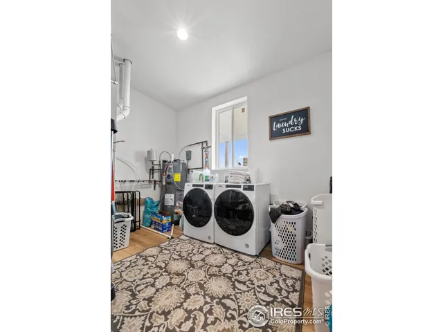 a utility room with a sink and a washer dryer