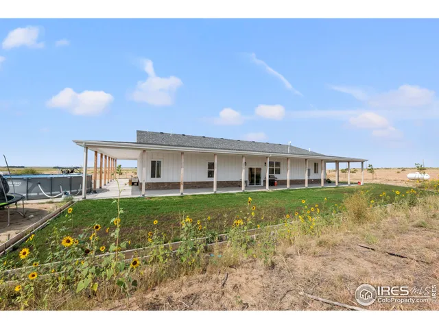 a view of a house with a big yard