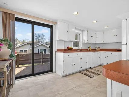 a view of kitchen with wooden floor