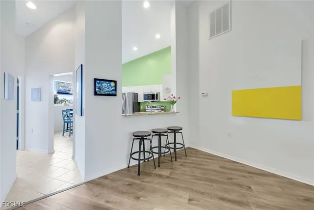a view of a dining room with furniture and wooden floor