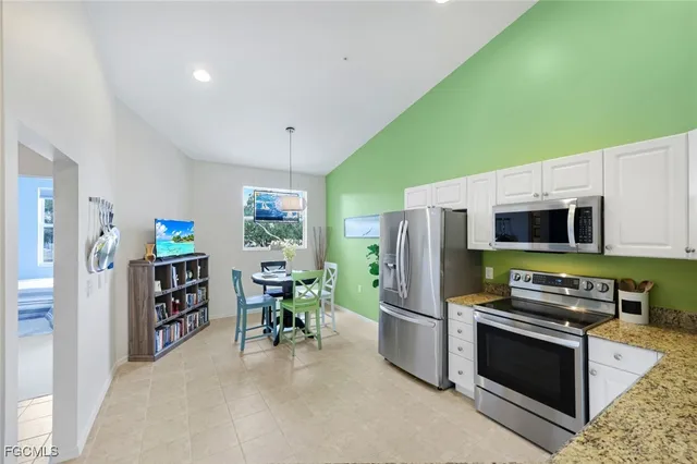 a kitchen with stainless steel appliances a stove and a refrigerator