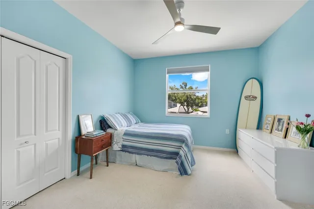 a bedroom with furniture and a window