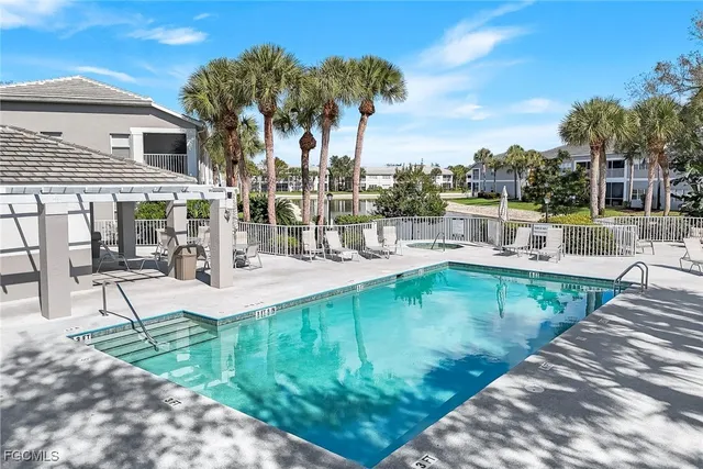 a view of a swimming pool with a patio