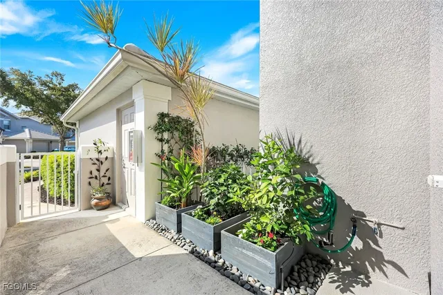 a view of a house with a flower garden