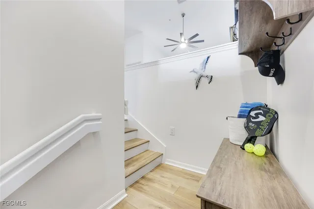 a view of entryway and hall with wooden floor