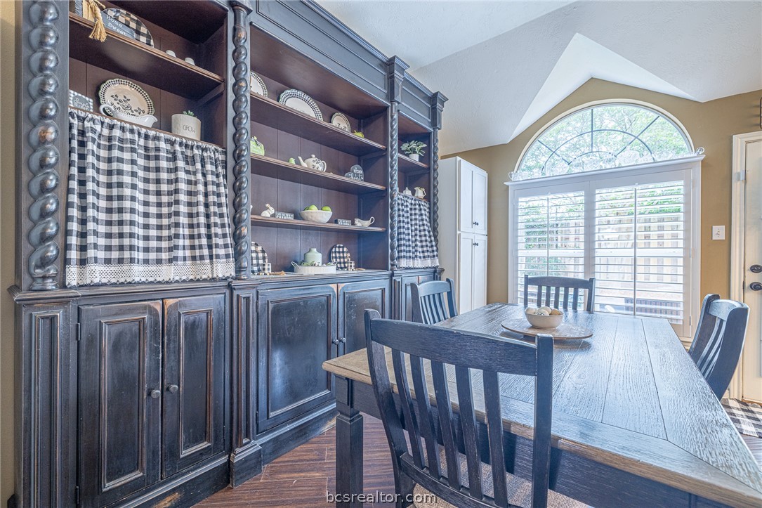 2633 Trophy Drive Bryan, TX 77802 - Photo 19 of 47 a view of a dining room with furniture a chandelier and wooden floor