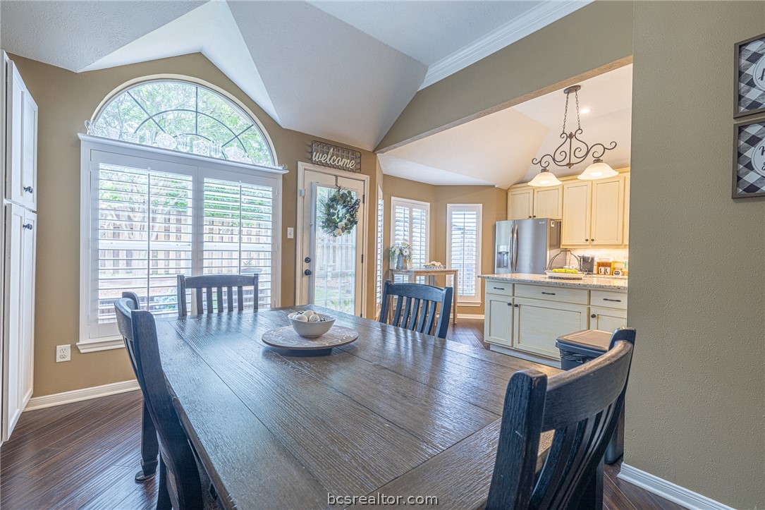 2633 Trophy Drive Bryan, TX 77802 - Photo 20 of 47 a outdoor dining room with furniture a chandelier and wooden floor