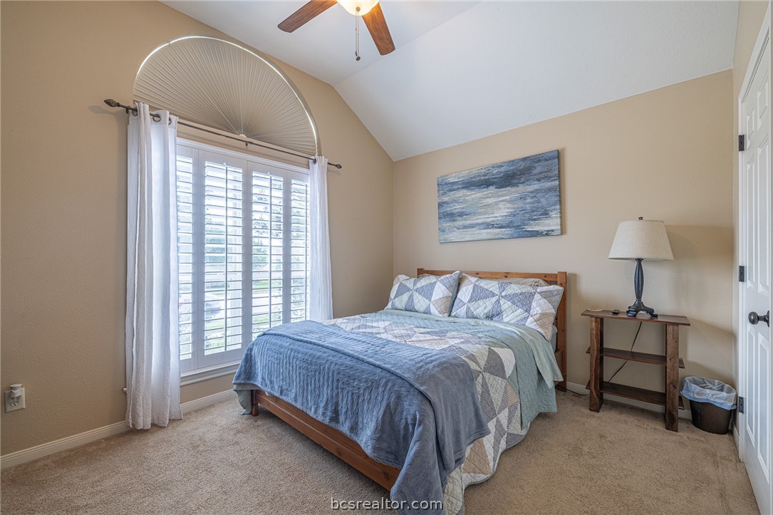 2633 Trophy Drive Bryan, TX 77802 - Photo 22 of 47 a bed sitting in a bedroom next to a window