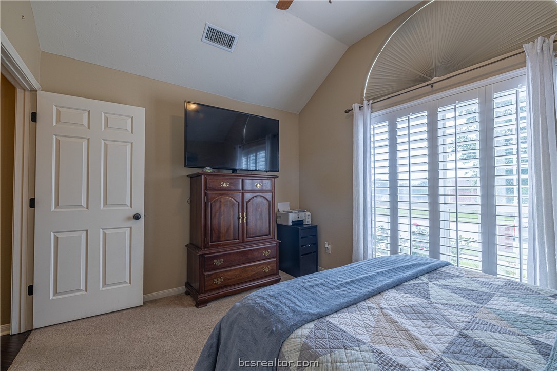 2633 Trophy Drive Bryan, TX 77802 - Photo 24 of 47 a bedroom with a bed and a television