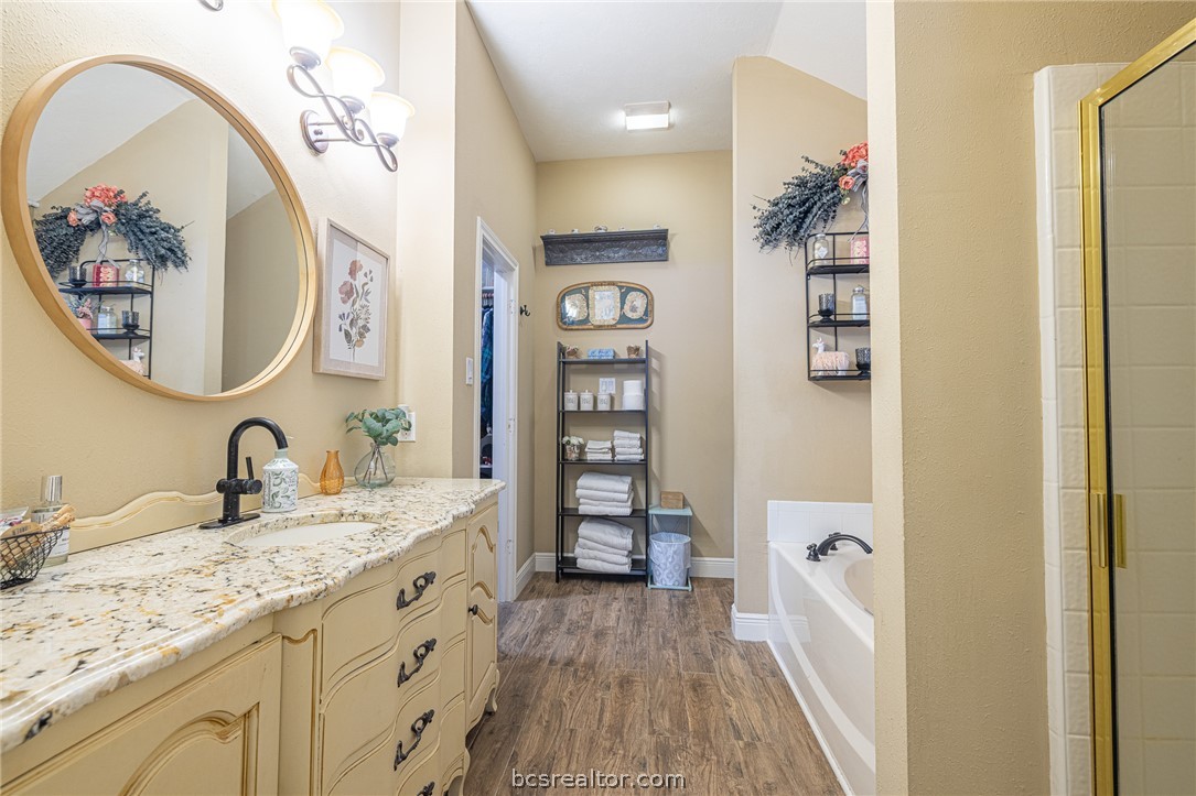 2633 Trophy Drive Bryan, TX 77802 - Photo 34 of 47 a bathroom with a sink and a mirror