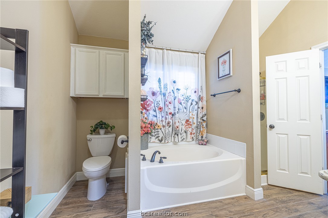 2633 Trophy Drive Bryan, TX 77802 - Photo 36 of 47 a bathroom with a toilet and a bathtub