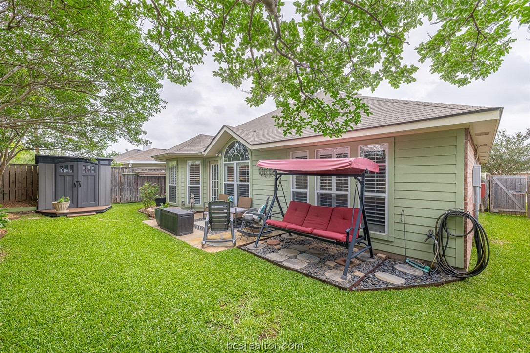 2633 Trophy Drive Bryan, TX 77802 - Photo 41 of 47 a front view of house with a garden and patio