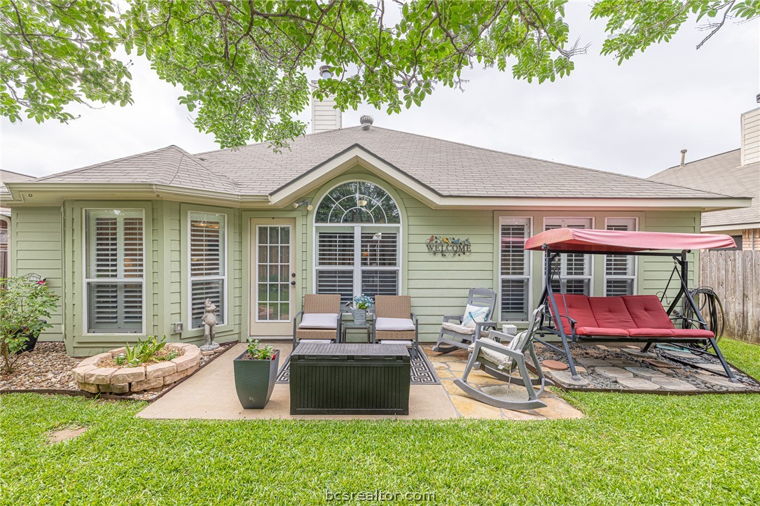 2633 Trophy Drive Bryan, TX 77802 - Photo 42 of 47 a front view of a house with a yard fire pit and outdoor seating