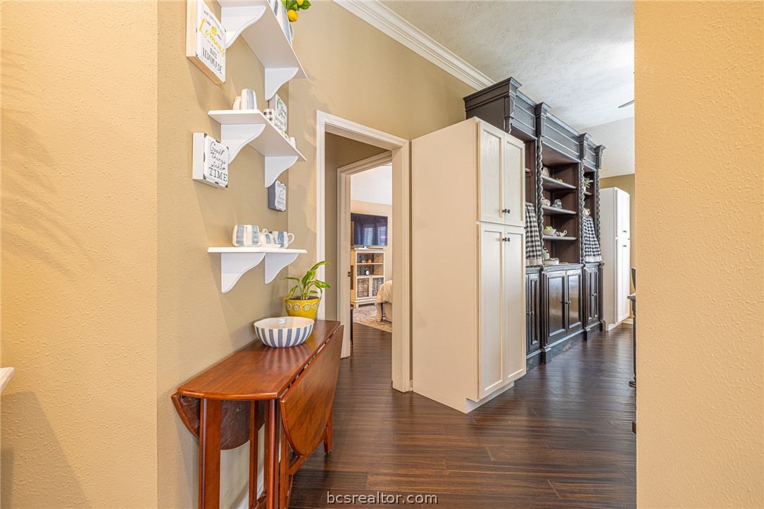 2633 Trophy Drive Bryan, TX 77802 - Photo 9 of 47 a view of a hallway with wooden floor and glass door