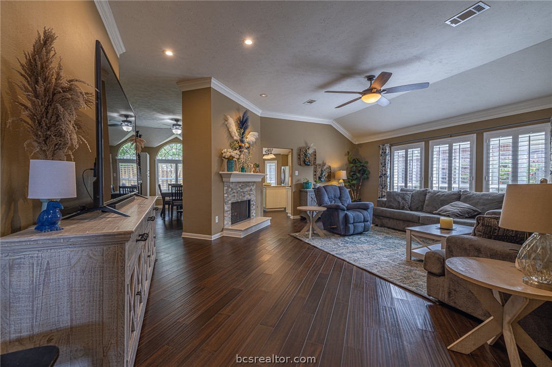 2633 Trophy Drive Bryan, TX 77802 - Photo 10 of 47 a living room with furniture a flat screen tv and a table
