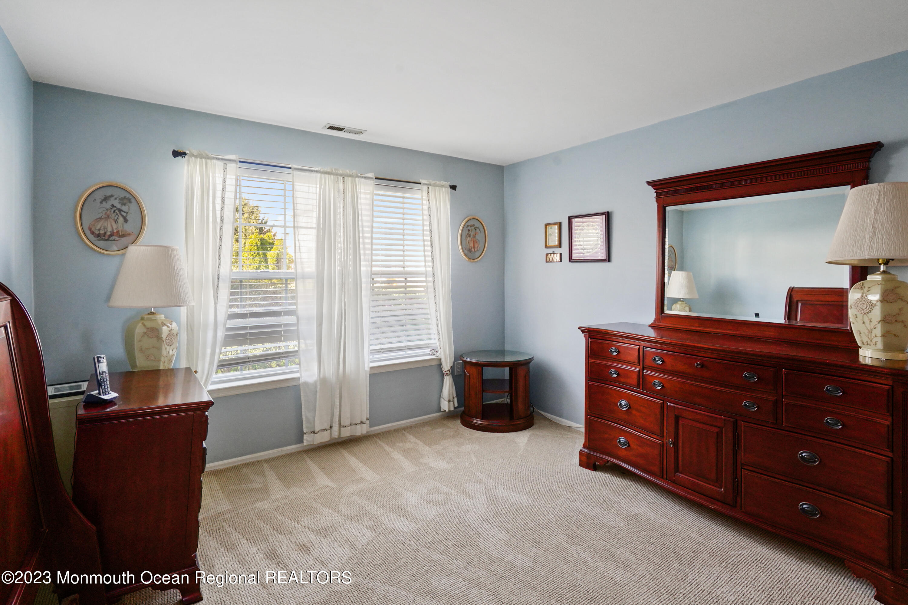 29 Racquet Road Wall, NJ 07719 - Photo 8 of 23 a room with furniture and a window