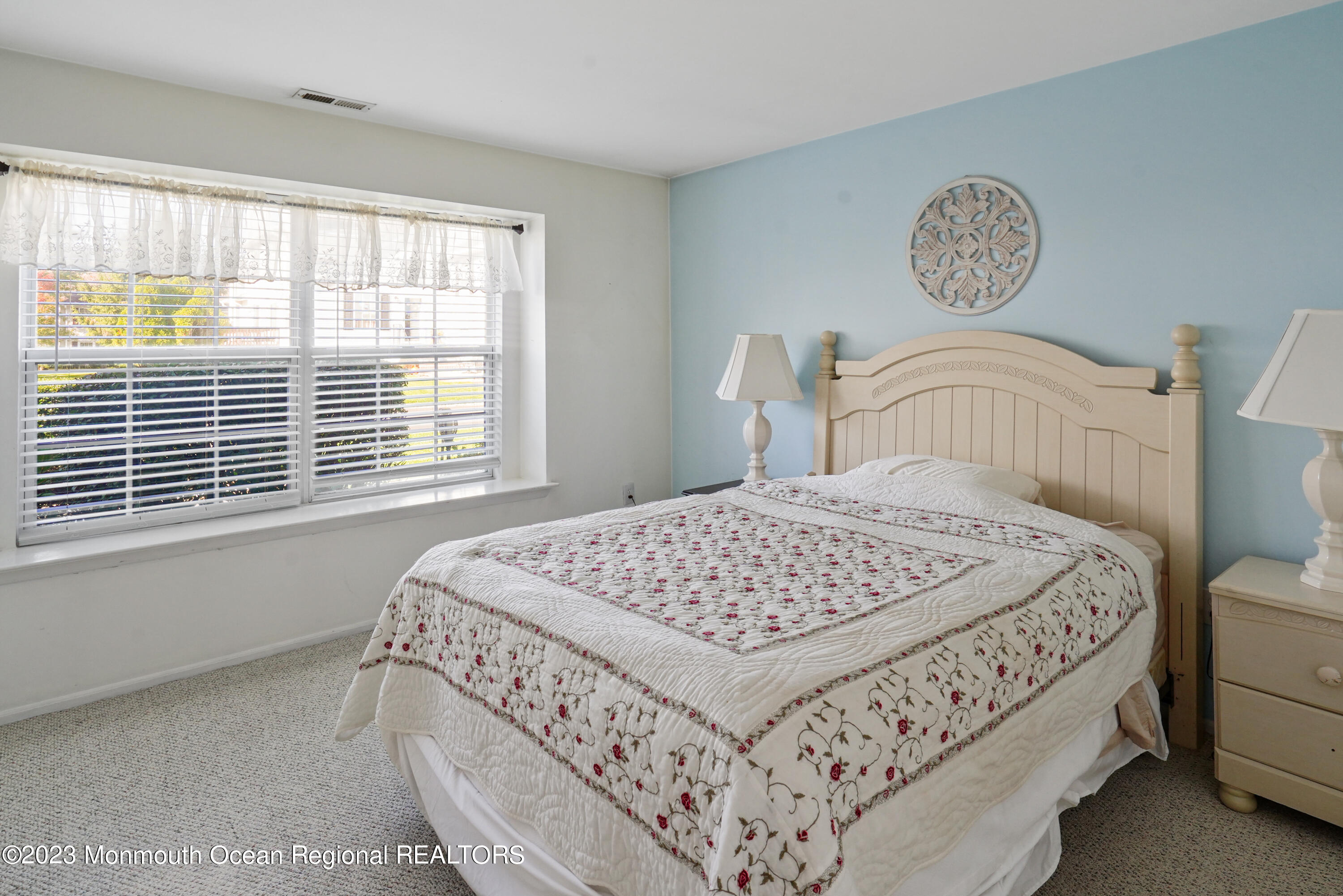 29 Racquet Road Wall, NJ 07719 - Photo 9 of 23 a bedroom with a bed and a window
