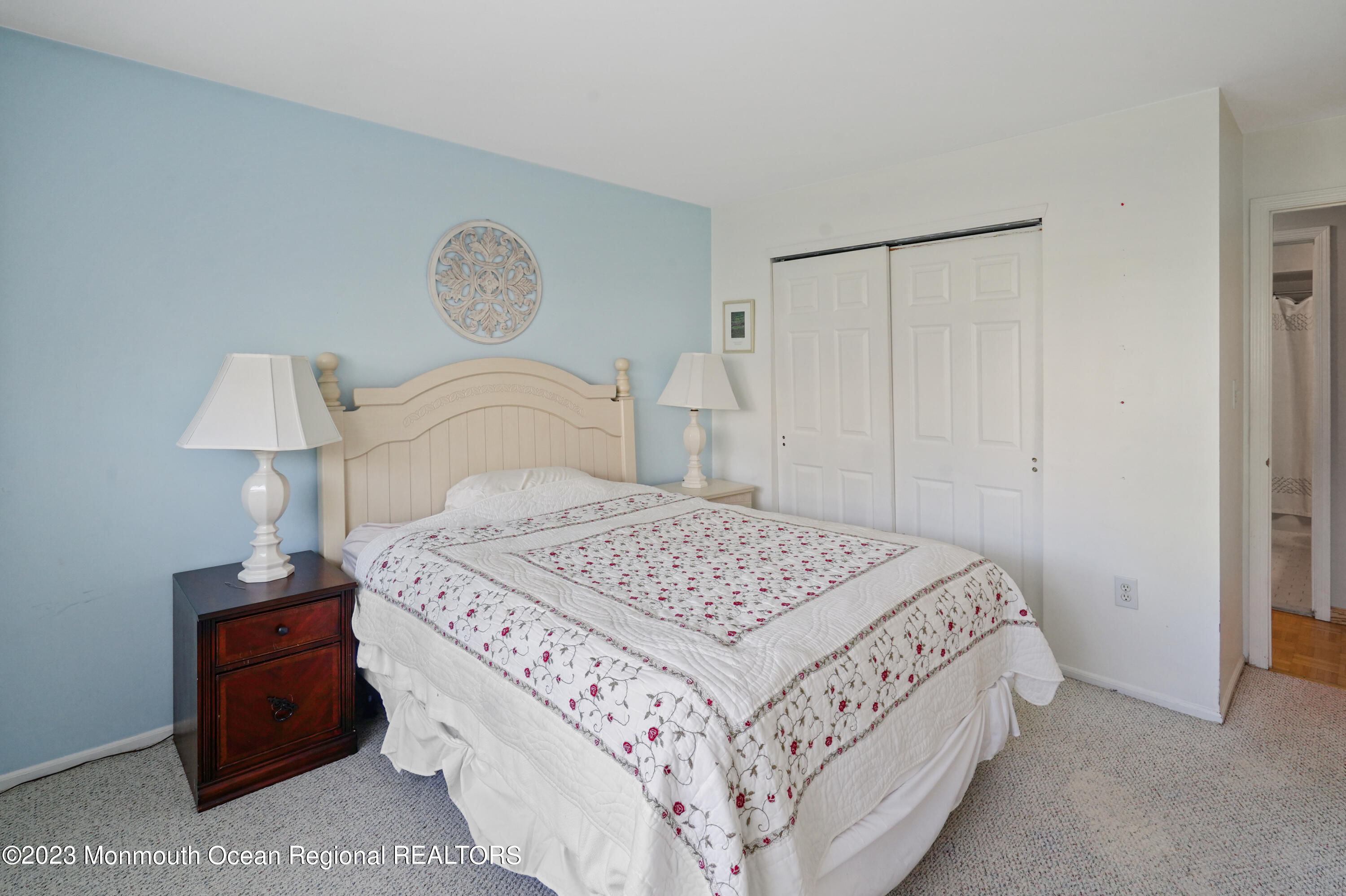 29 Racquet Road Wall, NJ 07719 - Photo 10 of 23 a bedroom with a bed and a lamp