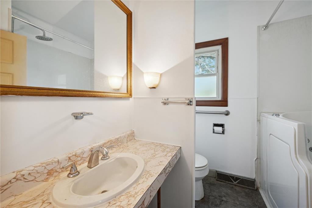 564 Rte 119 Highway North Indiana, PA 15701 - Photo 12 of 25 a bathroom with a sink a toilet and a mirror
