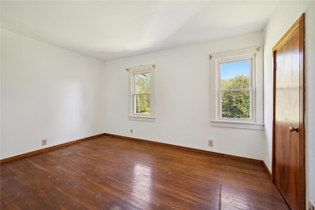 564 Rte 119 Highway North Indiana, PA 15701 - Photo 13 of 25 an empty room with wooden floor and windows