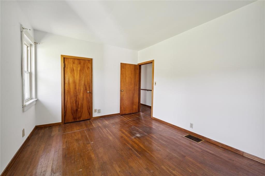 564 Rte 119 Highway North Indiana, PA 15701 - Photo 14 of 25 an empty room with wooden floor and closet