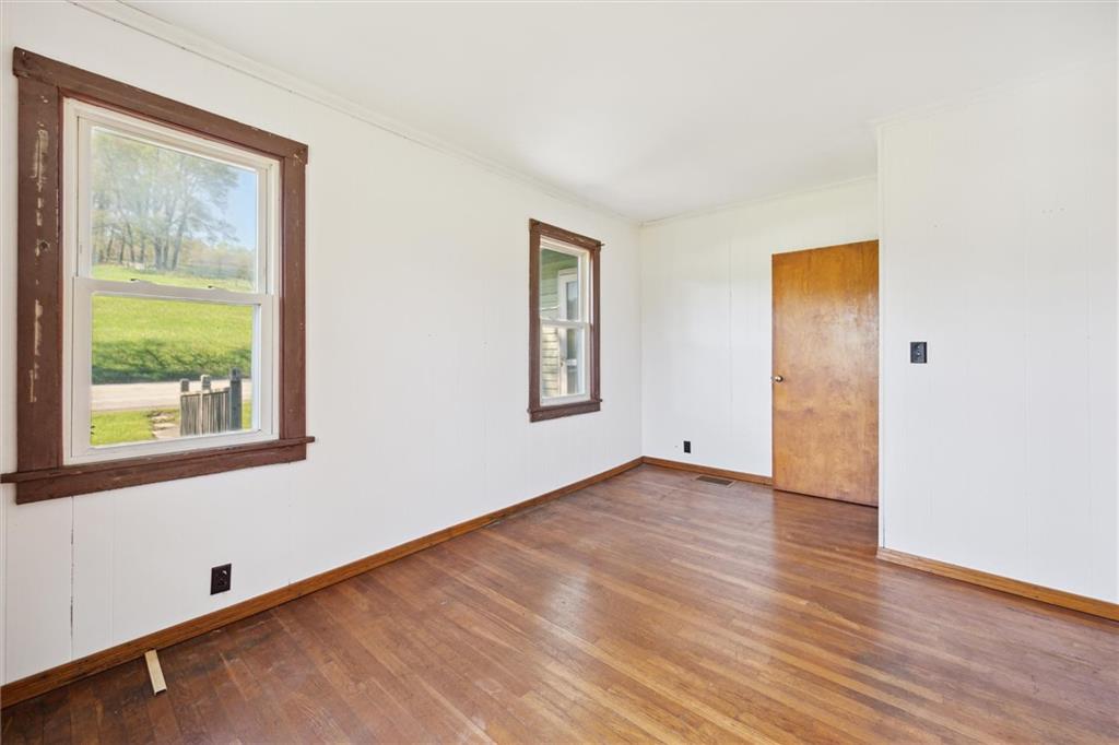 564 Rte 119 Highway North Indiana, PA 15701 - Photo 17 of 25 an empty room with wooden floor and windows