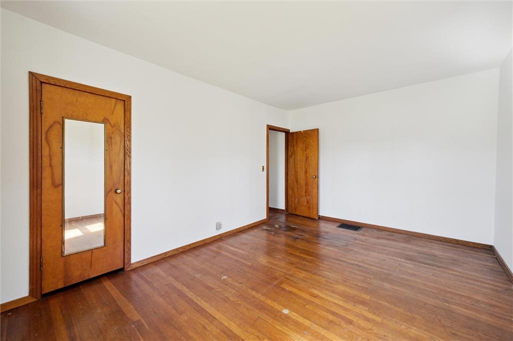 564 Rte 119 Highway North Indiana, PA 15701 - Photo 19 of 25 a view of an empty room with wooden floor and a window