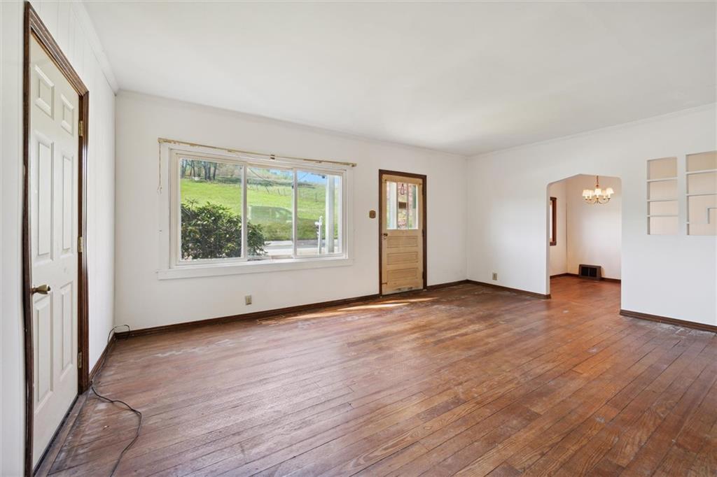 564 Rte 119 Highway North Indiana, PA 15701 - Photo 6 of 25 an empty room with wooden floor and windows
