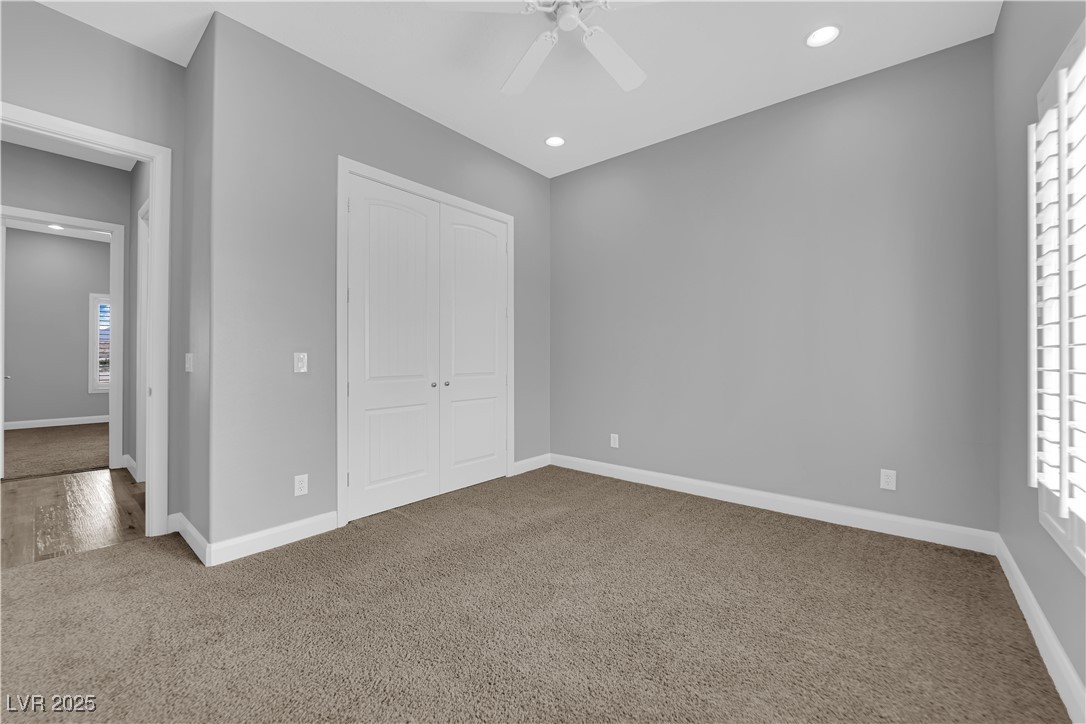 1415 Curohee Street Moapa, NV 89025 - Photo 18 of 54 Unfurnished bedroom with carpet, recessed lighting, a closet, and a ceiling fan