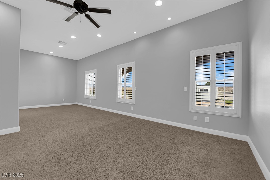 1415 Curohee Street Moapa, NV 89025 - Photo 26 of 54 Empty room featuring carpet floors, recessed lighting, and a ceiling fan