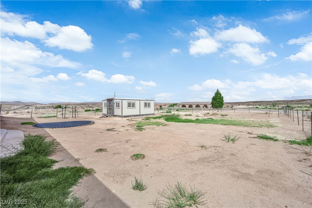 1415 Curohee Street Moapa, NV 89025 - Photo 38 of 54 View of yard featuring an outbuilding