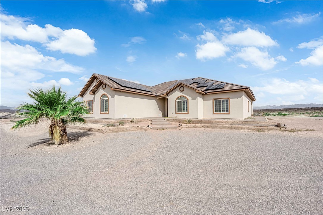 1415 Curohee Street Moapa, NV 89025 - Photo 42 of 54 Mediterranean / spanish house with stucco siding and solar panels