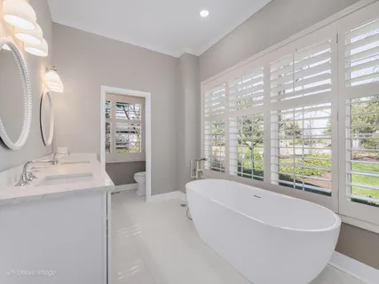 a bathroom with a bathtub and a sink
