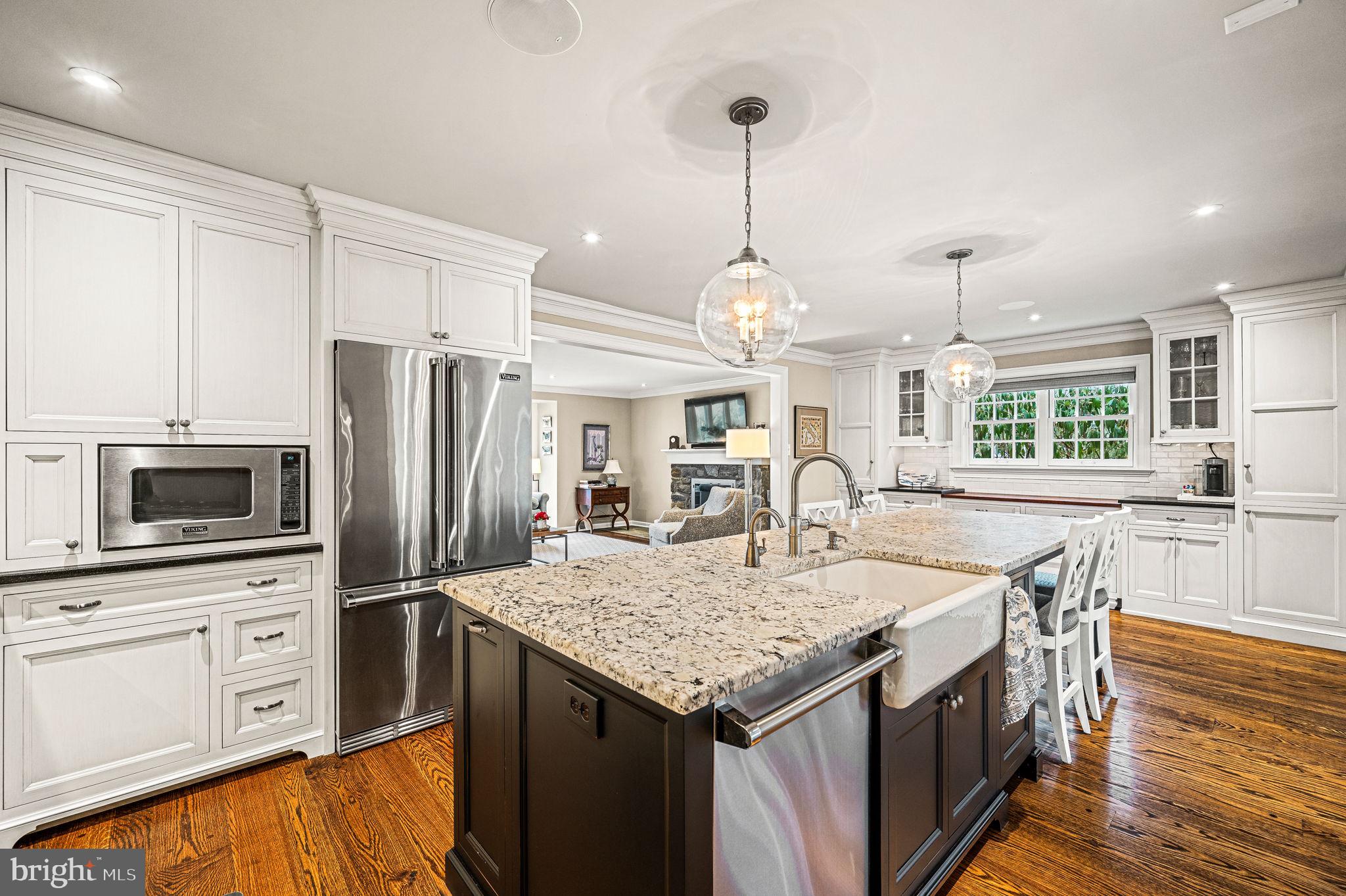 43 Crestline Road Wayne, PA 19087 - Photo 15 of 48 a kitchen with granite countertop kitchen island stainless steel appliances a sink stove and refrigerator