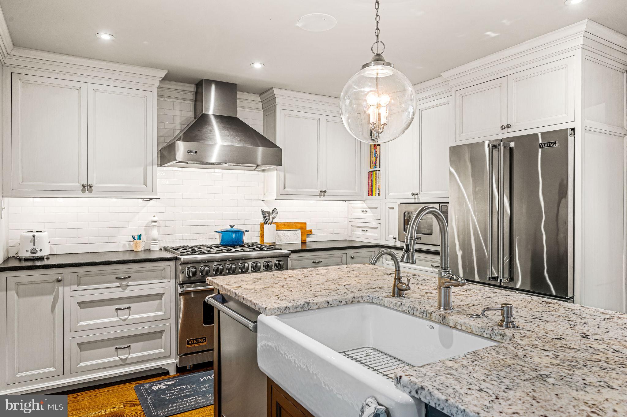43 Crestline Road Wayne, PA 19087 - Photo 16 of 48 a kitchen with granite countertop a sink stainless steel appliances and cabinets