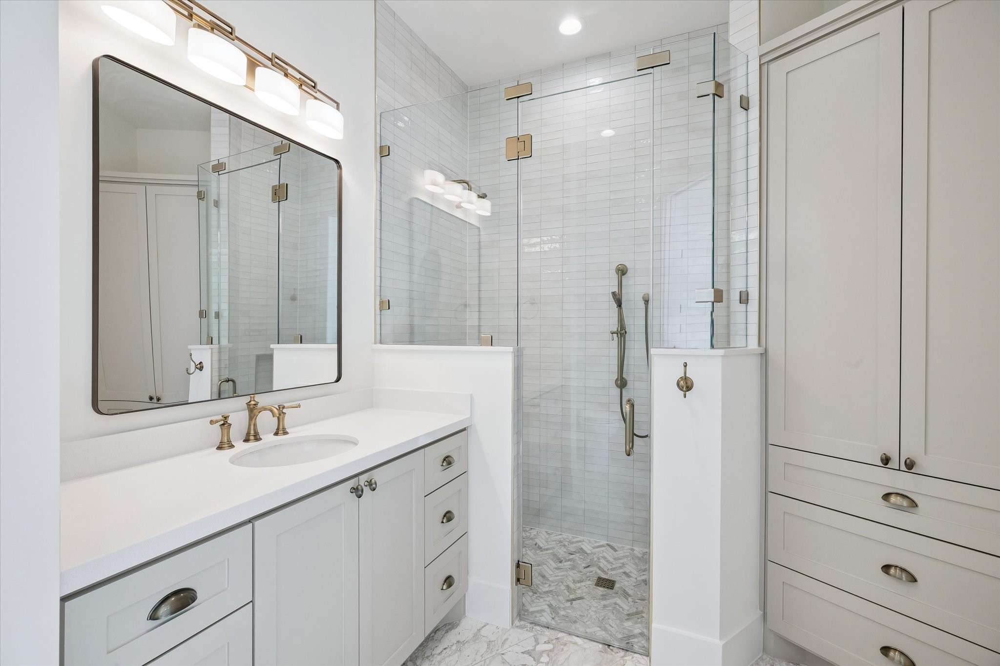 65 Shadow Creek Ridge Drive Spring, TX 77389 - Photo 23 of 41 Spa-inspired bathroom with quartz vanity, oversized glass shower, and sleek lighting for a polished finish.