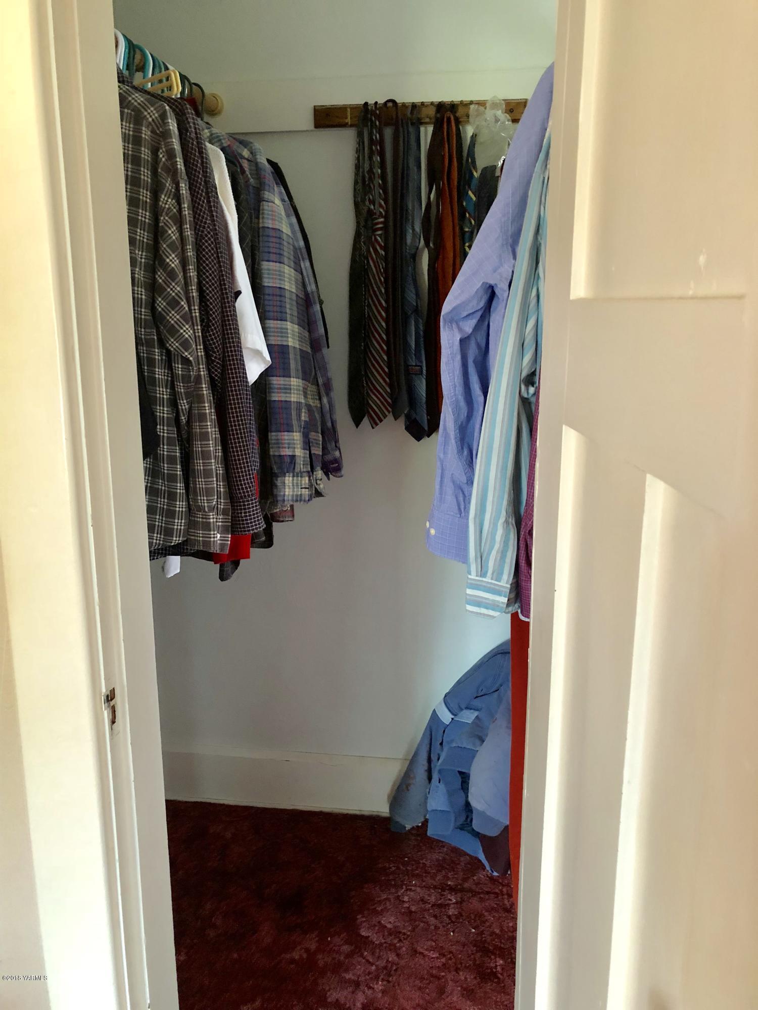 16573 Branch Road Harrah, WA 98933 - Photo 13 of 33 a view of walk in closet with clothes and shoes