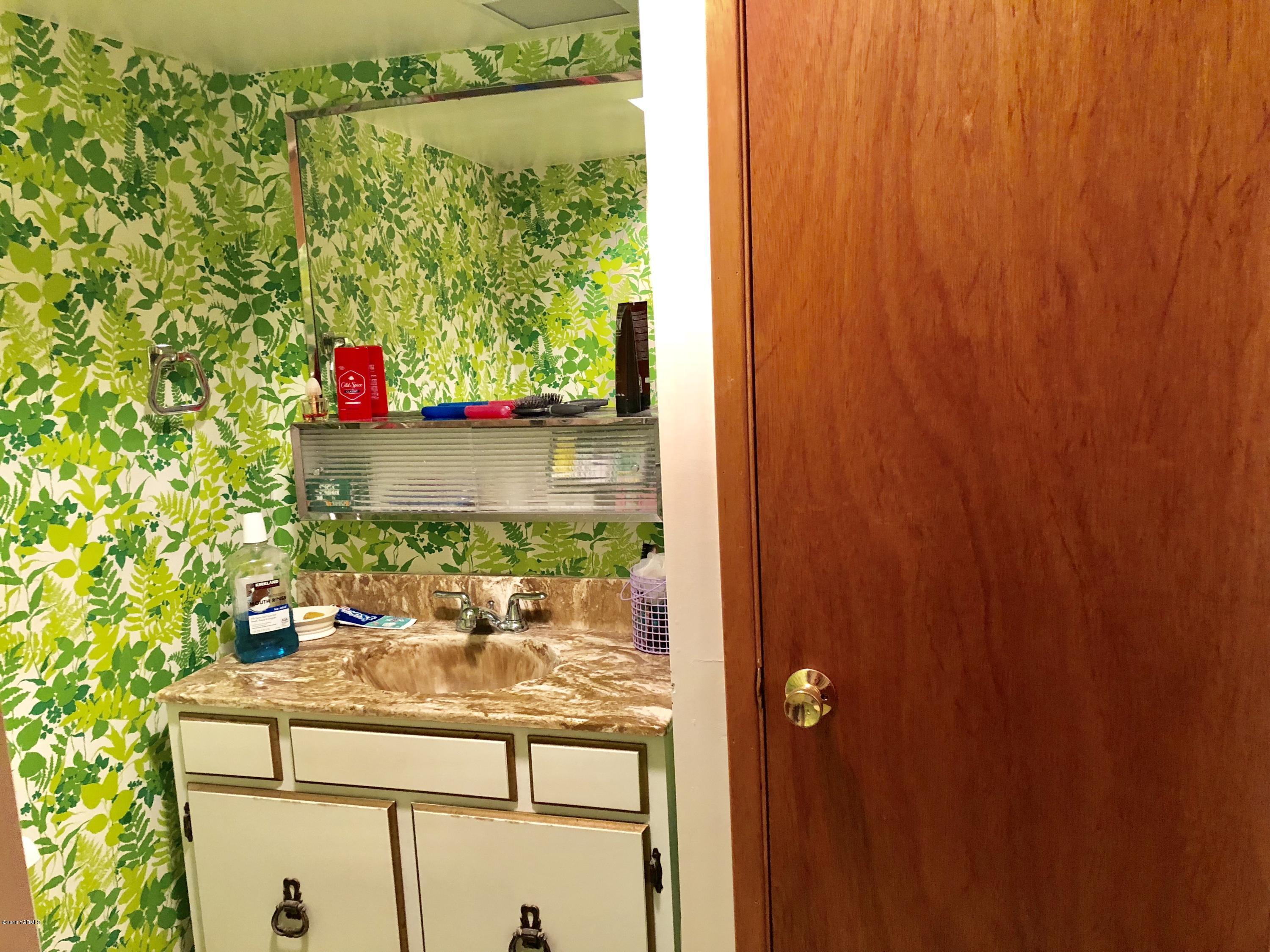 16573 Branch Road Harrah, WA 98933 - Photo 24 of 33 a bathroom with a sink and mirror