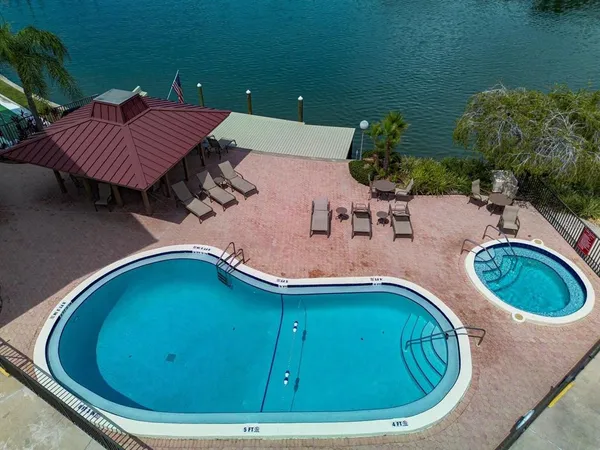 a backyard of a house with yard and outdoor seating