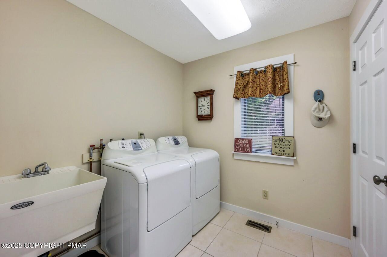 1179 Manor Hill Road Pocono Pines, PA 18350 - Photo 11 of 28 a utility room with dryer and washer
