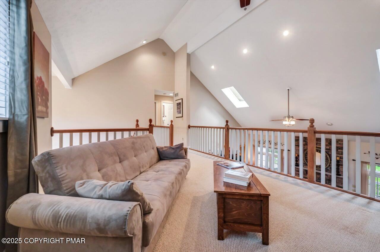1179 Manor Hill Road Pocono Pines, PA 18350 - Photo 20 of 28 a living room with furniture and a ceiling fan