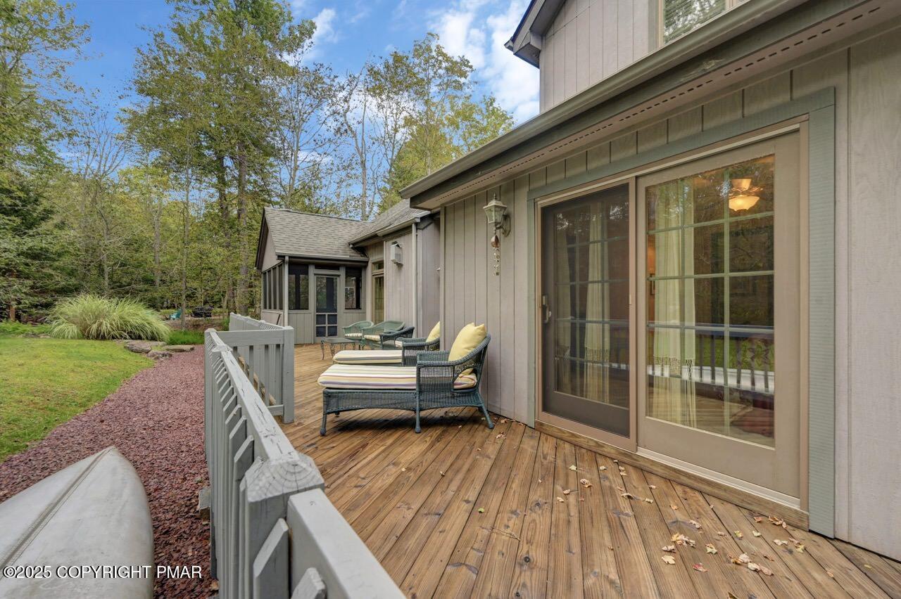 1179 Manor Hill Road Pocono Pines, PA 18350 - Photo 27 of 28 a house view with a seating space and garden view
