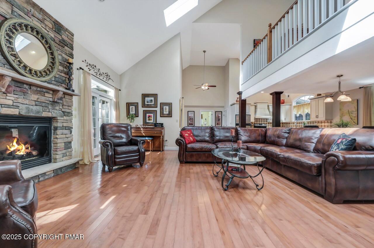 1179 Manor Hill Road Pocono Pines, PA 18350 - Photo 3 of 28 a living room with furniture and a fireplace