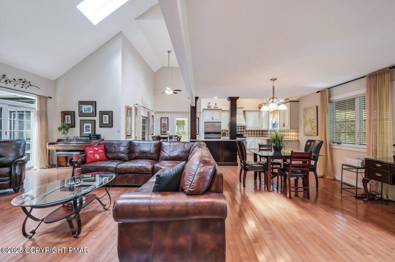 1179 Manor Hill Road Pocono Pines, PA 18350 - Photo 5 of 28 a living room with furniture kitchen view and a wooden floor