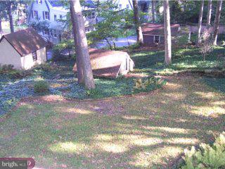 149 Hewett Road Wyncote, PA 19095 - Photo 3 of 6 a view of a yard with plants and trees