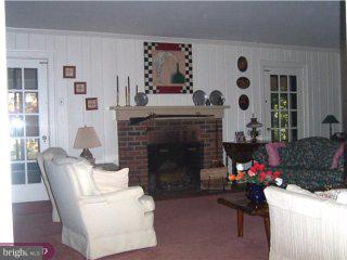 149 Hewett Road Wyncote, PA 19095 - Photo 5 of 6 a living room with furniture and a fireplace