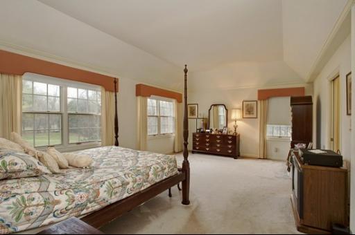 2045 Winnetka Road Northfield, IL 60093 - Photo 11 of 16 a bedroom with a large bed and a large window