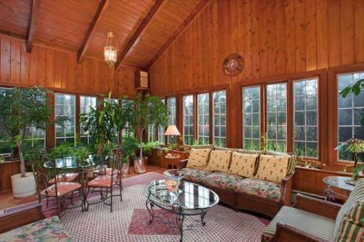 2045 Winnetka Road Northfield, IL 60093 - Photo 7 of 16 a living room with furniture a fireplace and a floor to ceiling window