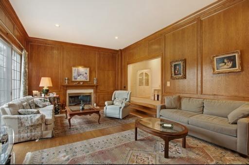 2045 Winnetka Road Northfield, IL 60093 - Photo 8 of 16 a living room with furniture a fireplace and a potted plant