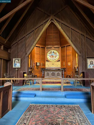 a living room with a table tennis table and a rug